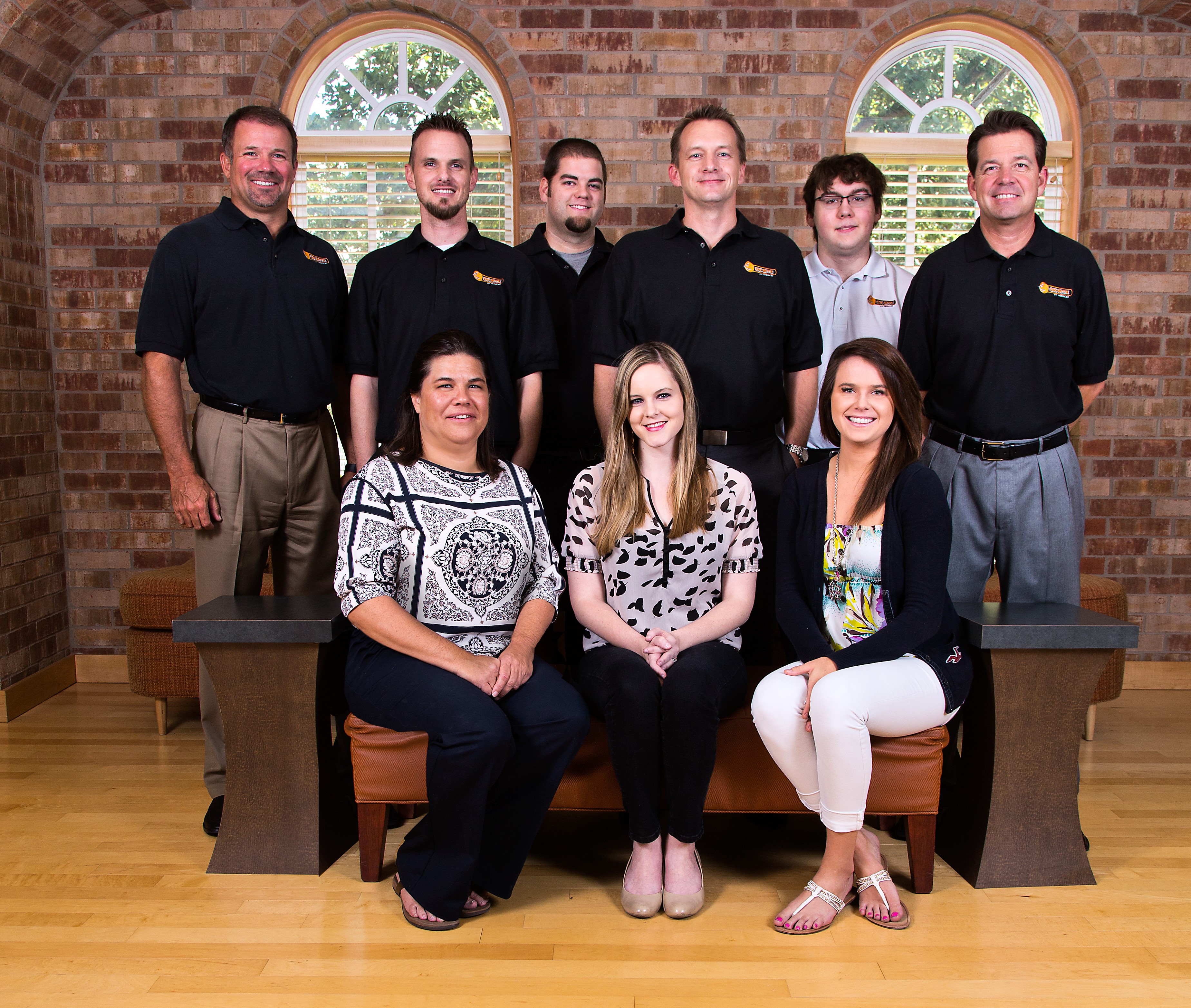 Nine members of the OSIT team gathered for a company portrait